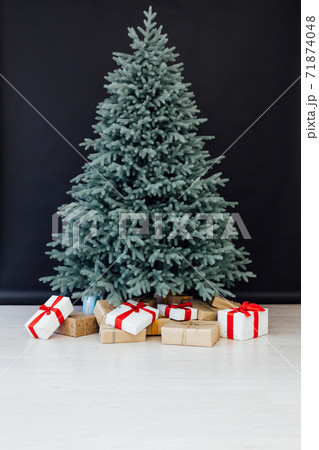 Decor Christmas blue Christmas tree with gifts and garlands interior new year 71874048