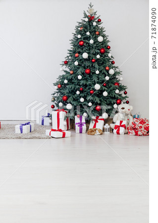 New Year's decoration Christmas tree with gifts and garlands 71874090