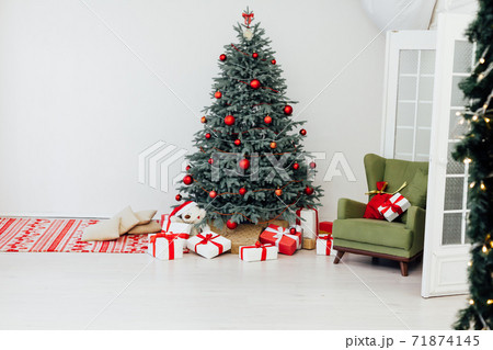Christmas tree decor pine with gifts and garlands interior new year Christmas tree decor pine with gifts and garlands interior new year 71874145