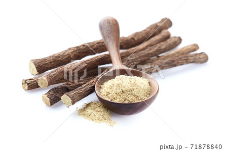 Licorice roots with powder on white Licorice roots with powder on white 71878840