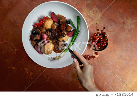 delicious Hummus dish with berries, veggies and sauce in restaurant background. Hummus dish for restaurant delicious Hummus dish with berries, veggies and sauce in restaurant background. Hummus dish for restaurant 71881014