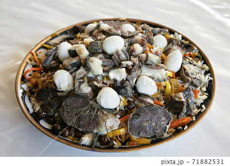 Uzbek national dish pilaf on a plate Uzbek national dish pilaf on a plate 71882531