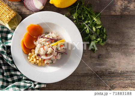 Traditional peruvian ceviche with fish, sweet potato, corn and vegetables Traditional peruvian ceviche with fish, sweet potato, corn and vegetables 71883188