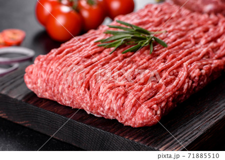 Fresh raw beef mince on a dark background Fresh raw beef mince on a dark background 71885510