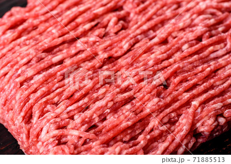Fresh raw beef mince on a dark background Fresh raw beef mince on a dark background 71885513