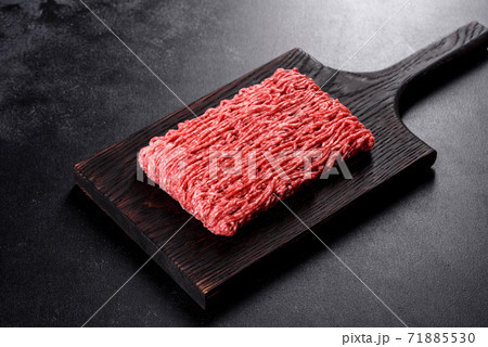 Fresh raw beef mince on a dark background 71885530