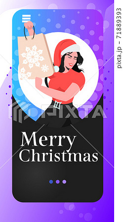 woman in santa hat holding shopping bag new year christmas holidays celebration big sale concept 71889393