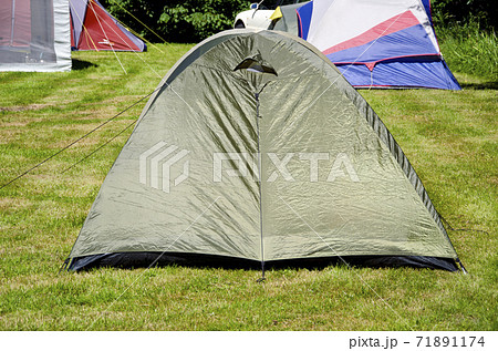 tent camping on summer grass 71891174
