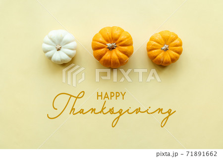Happy Thanksgiving Day with pumpkin on yellow background Happy Thanksgiving Day with pumpkin on yellow background 71891662
