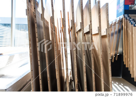 Samples of wooden furniture MDF profiles in sunlight. selective focus Samples of wooden furniture MDF profiles in sunlight. selective focus 71899976