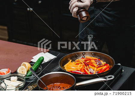chef making healthy fresh fajitas or fajitos with beef. Easy, but tasty, healthy. National Mexican food, fresh oganic food. 71900215
