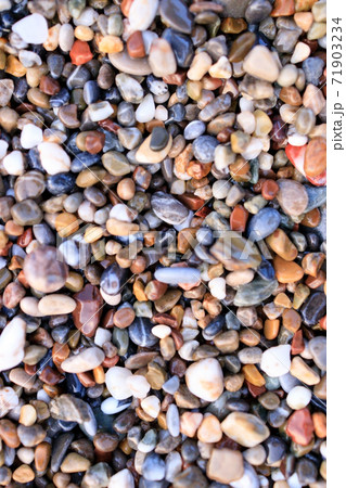 Background of colored sea pebbles on the beach of Alanya, Turkey. Seamless texture Background of colored sea pebbles on the beach of Alanya, Turkey. Seamless texture 71903234
