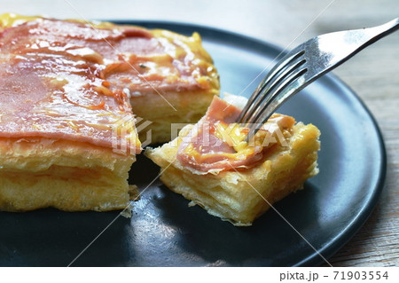 grilled toast topping ham pork and cheese stabbing by fork on plate grilled toast topping ham pork and cheese stabbing by fork on plate 71903554