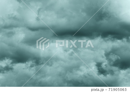 Dramatic storm clouds in rainy weather in sky, coloring in trend Tidewater Green color of year 2021. Meteorology abstract texture, nature background 71905063
