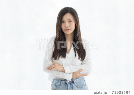 Portrait of beautiful and cute long hair Asian woman standing and looking to camera with a little smile on her face 71905594