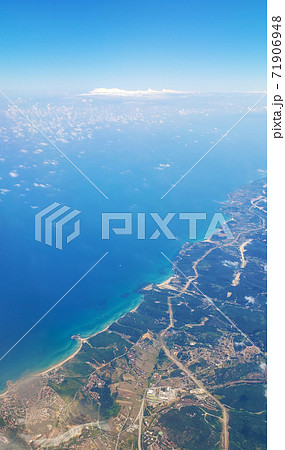 The view from the airplane window to the ground. Landscape view from the sky 71906948