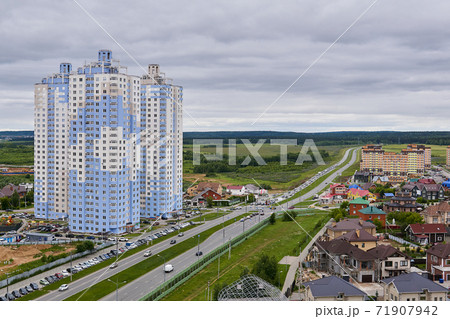 spur route leads out of the city through a suburban and commuter areas in Perm, Russia 71907942