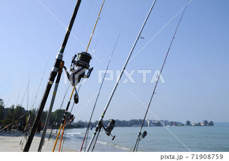 PORT DICKSON, MALAYSIA -APRIL 28, 2017: Fishing rods complete with the motor used by fisherman. These rods are used to fish in coastal fishing. PORT DICKSON, MALAYSIA -APRIL 28, 2017: Fishing rods complete with the motor used by fisherman. These rods are used to fish in coastal fishing. 71908759
