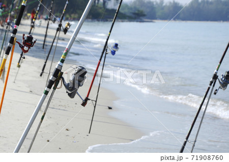 PORT DICKSON, MALAYSIA -APRIL 28, 2017: Fishing rods complete with the motor used by fisherman. These rods are used to fish in coastal fishing. PORT DICKSON, MALAYSIA -APRIL 28, 2017: Fishing rods complete with the motor used by fisherman. These rods are used to fish in coastal fishing. 71908760