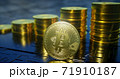 3d render of metallic bitcoin with rising columns of coins in background. 71910187