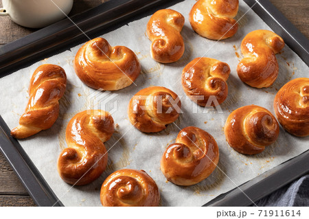 Jidasky or jidase - Czech sweet Easter pastry on a baking sheet Jidasky or jidase - Czech sweet Easter pastry on a baking sheet 71911614