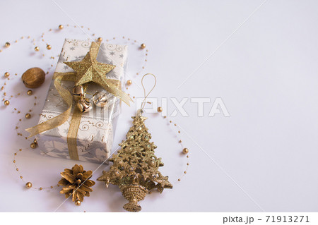 christmas composition. Christmas gift, pine, nut, on a white background. 71913271