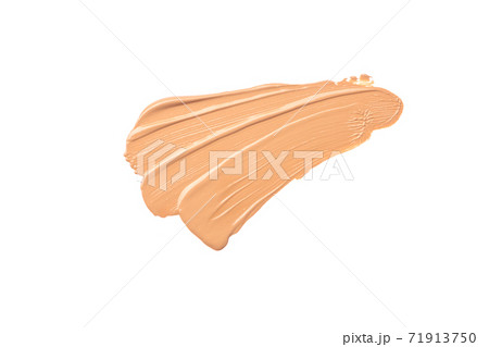Bright beige smear of foundation in the form of a group of diagonal strokes isolated on a white background. Bright beige smear of foundation in the form of a group of diagonal strokes isolated on a white background. 71913750