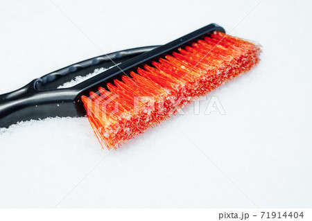 orange snow brush for car, snowflakes background orange snow brush for car, snowflakes background 71914404