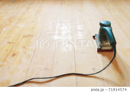 wooden floor sanding with flat sander tool 71914574