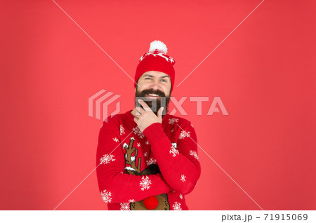 Bearded face close up red background. Cold days. Winter 71915069