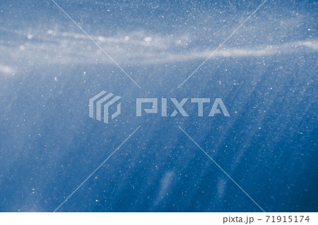sunny blue underwater background with particles 71915174