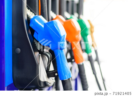 Colorful Petrol pump filling nozzles isolated on white background , Gas station in a service 71921405
