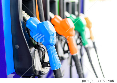 Colorful Petrol pump filling nozzles isolated on white background , Gas station in a service 71921406