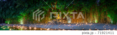 monks sitting meditate with many candle in Thai temple at night , Chiangmai ,Thailand, monks sitting meditate with many candle in Thai temple at night , Chiangmai ,Thailand, 71921411