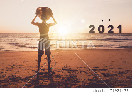 New year 2021 is coming with sunset beach background. New start for planing or set new resolution in life. New year 2021 is coming with sunset beach background. New start for planing or set new resolution in life. 71921478