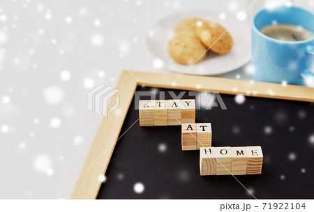 chalkboard with stay at home words on toy blocks 71922104