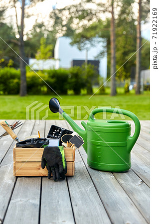 box with garden tools and watering can in summer box with garden tools and watering can in summer 71922169