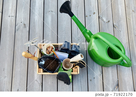 box with garden tools and watering can in summer box with garden tools and watering can in summer 71922170