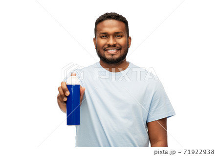happy african man showing shaving foam to camera 71922938