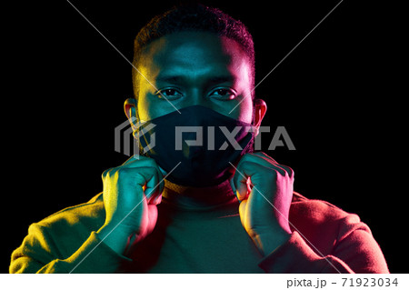 african american man wearing black reusable mask african american man wearing black reusable mask 71923034