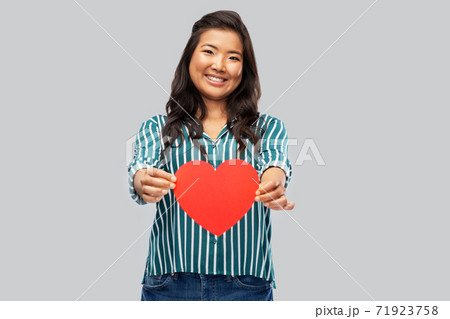 happy asian woman with red heart happy asian woman with red heart 71923758