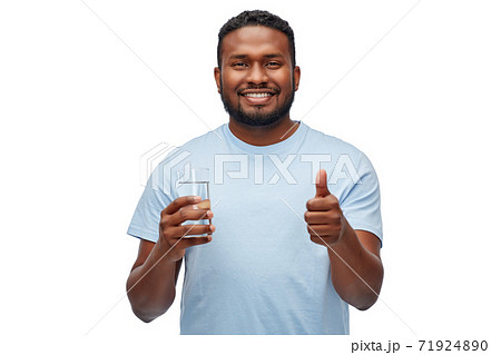 happy african american man with glass of water 71924890