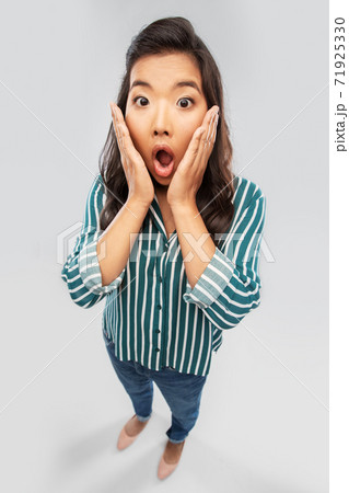 shocked asian woman with open mouth goggling 71925330
