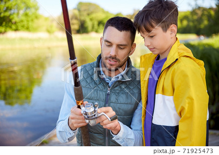father and son fishing on river father and son fishing on river 71925473
