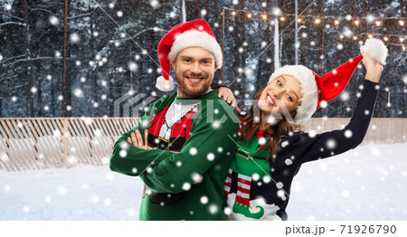 happy couple in ugly sweaters on christmas happy couple in ugly sweaters on christmas 71926790