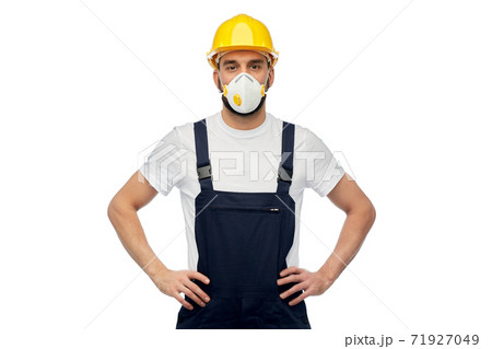 male worker or builder in helmet and respirator male worker or builder in helmet and respirator 71927049