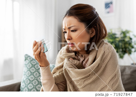 sick asian woman with medicine at home sick asian woman with medicine at home 71927847