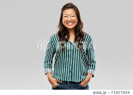 happy asian woman in glasses or student happy asian woman in glasses or student 71927934