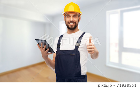 worker or builder with tablet pc showing thumbs up 71928551