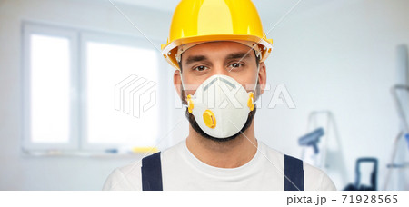 male worker or builder in helmet and respirator male worker or builder in helmet and respirator 71928565
